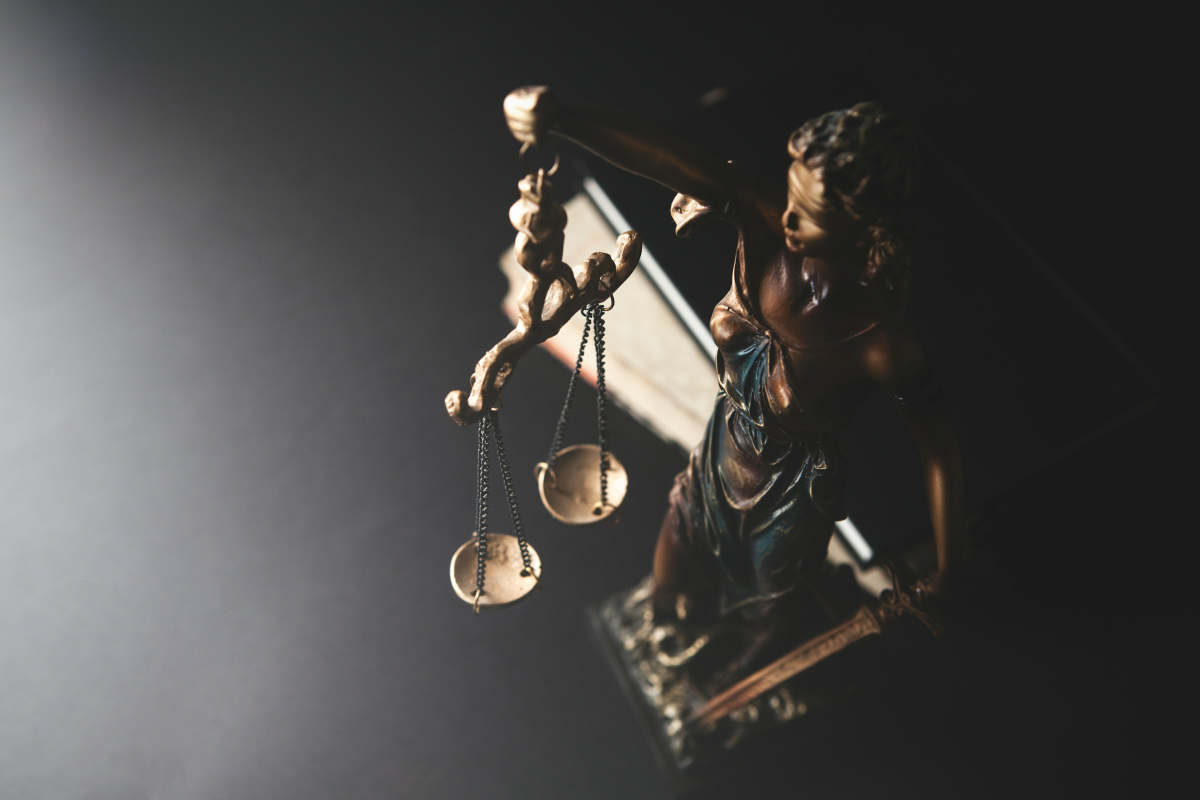 Bronze statue of Lady Justice holding the scales